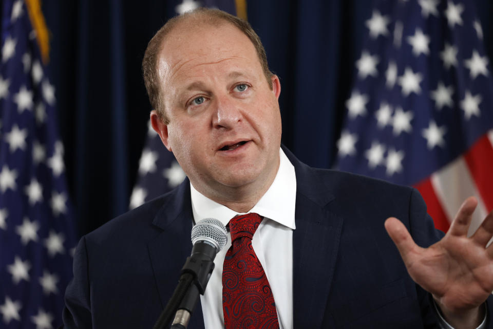 Colorado Governor Jared Polis makes a point during a news conference on the state's efforts against the new coronavirus Tuesday, July 21, 2020, in Denver. (AP Photo/David Zalubowski)