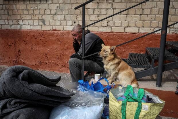 A Vovchansk resident who fled Russian shelling is seen Monday after his arrival at an evacuation centre in Kharkiv, Ukraine. Kharkiv Gov. Oleh Syniehubov says some 7,500 people have been evacuated from Vovchansk and nearby areas.