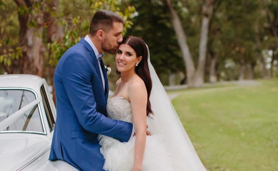 Wildcats player Tom Jervis and Jazze McNeil on their wedding day. Picture: Sarah Kate Dorman Photography