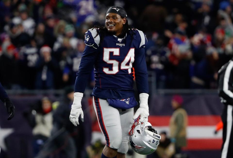 New England outside linebacker Dont'a Hightower smiles as he leaves the field.