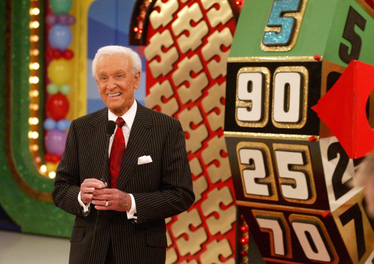 Bob Barker next to The Price Is Right wheel