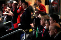 <p>U.S. President Donald Trump, flanked by ROTC students, attends the NCAA College Football Playoff Championship game between Alabama and Georgia in Atlanta, Georgia, U.S. January 8, 2018. REUTERS/Jonathan Ernst </p>