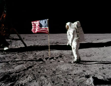 Buzz Aldrin poses for a photograph beside the deployed United States flag on the moon