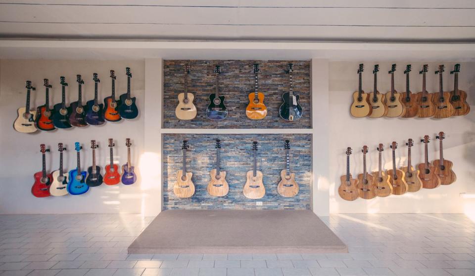 guitars hanging display on wall for sale