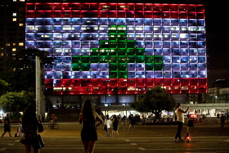 The municipality building is lit in the colours of the Lebanese flag in Tel Aviv