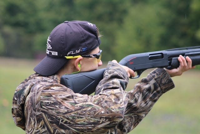 Pellston's Zac Jamroz gets ready to fire during a single shooting clay target event.