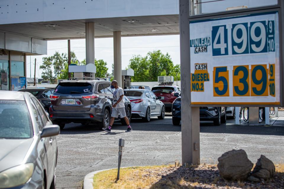 Customers line up for cheaper gas prices at the station on the corner of 20th Street and Osborn Road in Phoenix on June 21, 2022.