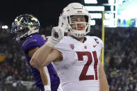 Washington State running back Max Borghi (21) reacts and holds up two fingers after he scored a touchdown against Washington during the second half of an NCAA college football game, Friday, Nov. 26, 2021, in Seattle. (AP Photo/Ted S. Warren)