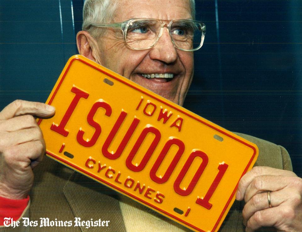 From 1989: Ed Cunningham of Des Moines holds the first Iowa State University license plate issued in Iowa.
