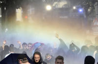 <p>A police water cannon sprays water onto demonstrators who block a road on the first day of the G-20 summit in Hamburg, northern Germany, Friday, July 7, 2017. (Photo: Matthias Schrader/AP) </p>