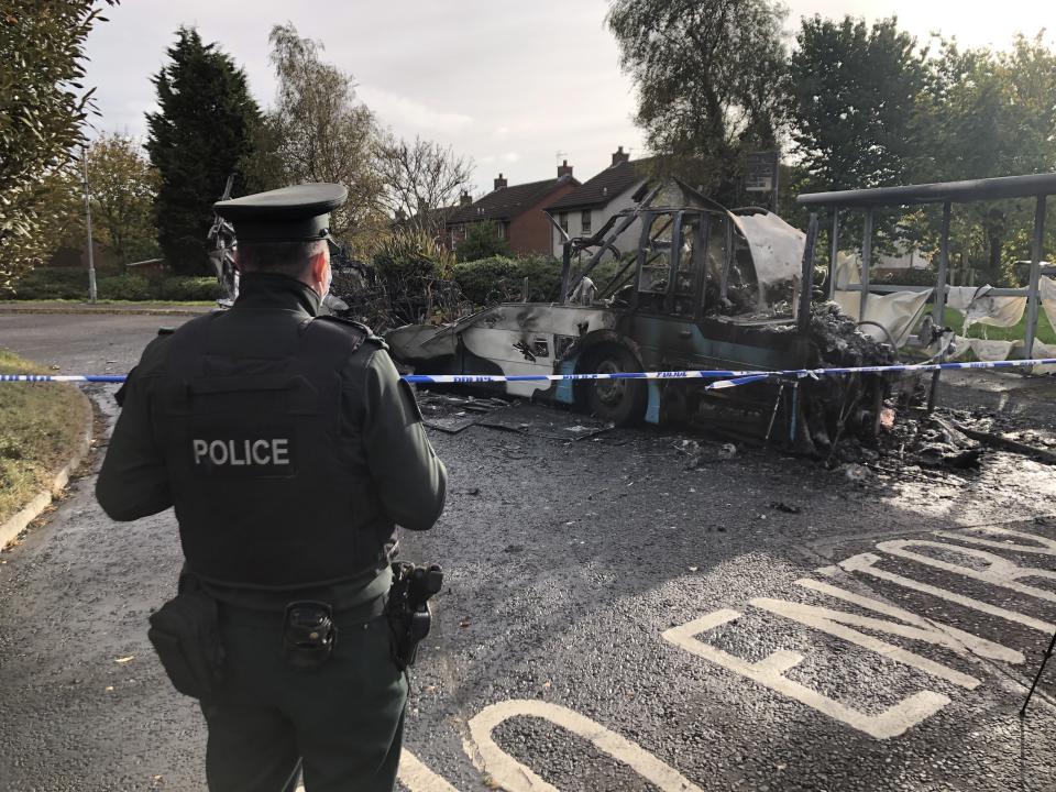 A police officer at the scene of the attack on the bus in Newtownards (David Young/PA)