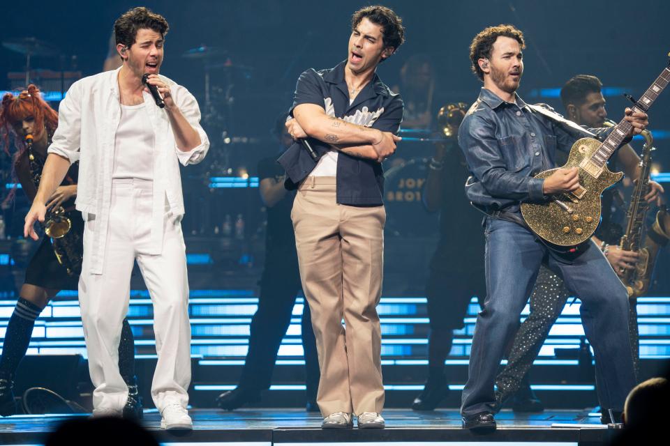 Nick, from left, Joe and Kevin Jonas perform at The Moody Center on Sunday, Sept. 3, 2023.
