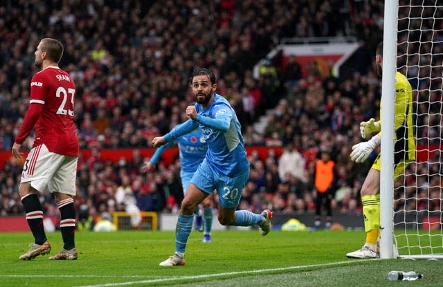 Bernardo Silva celebrates scoring Manchester City's second goal at Manchester United (Martin Rickett/PA).