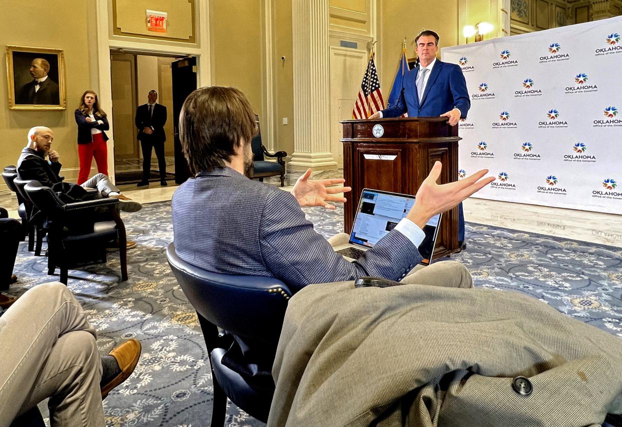 Gov. Kevin Stitt answers questions from reporters during his weekly news conference Friday at the state Capitol.