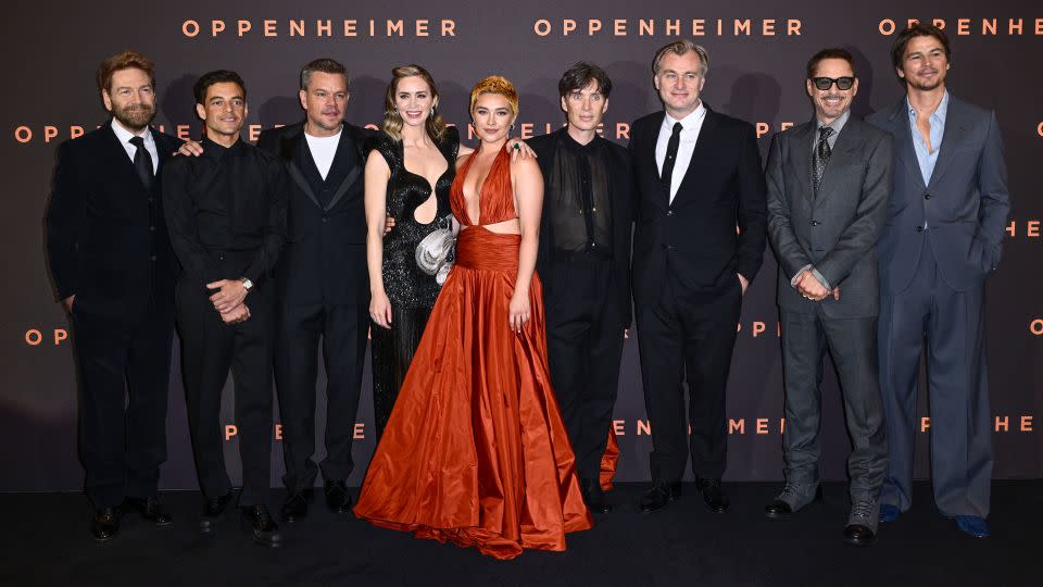 (From left) Kenneth Branagh, Rami Malek, Matt Damon, Emily Blunt, Florence Pugh, Cillian Murphy, Christopher Nolan, Robert Downey Jr. and Josh Hartnett at the UK premiere of "Oppenheimer" in July.  - Gareth Cattermole/Getty Images