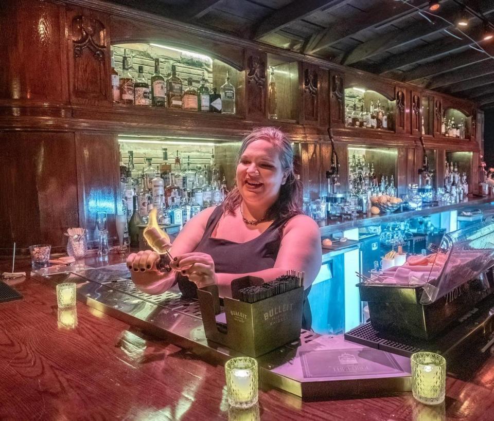 Barkeep Maggie McReynolds ignited marshmallows as embellishment for a specialty drink at The Forge. Roy Inman/Special to The Star