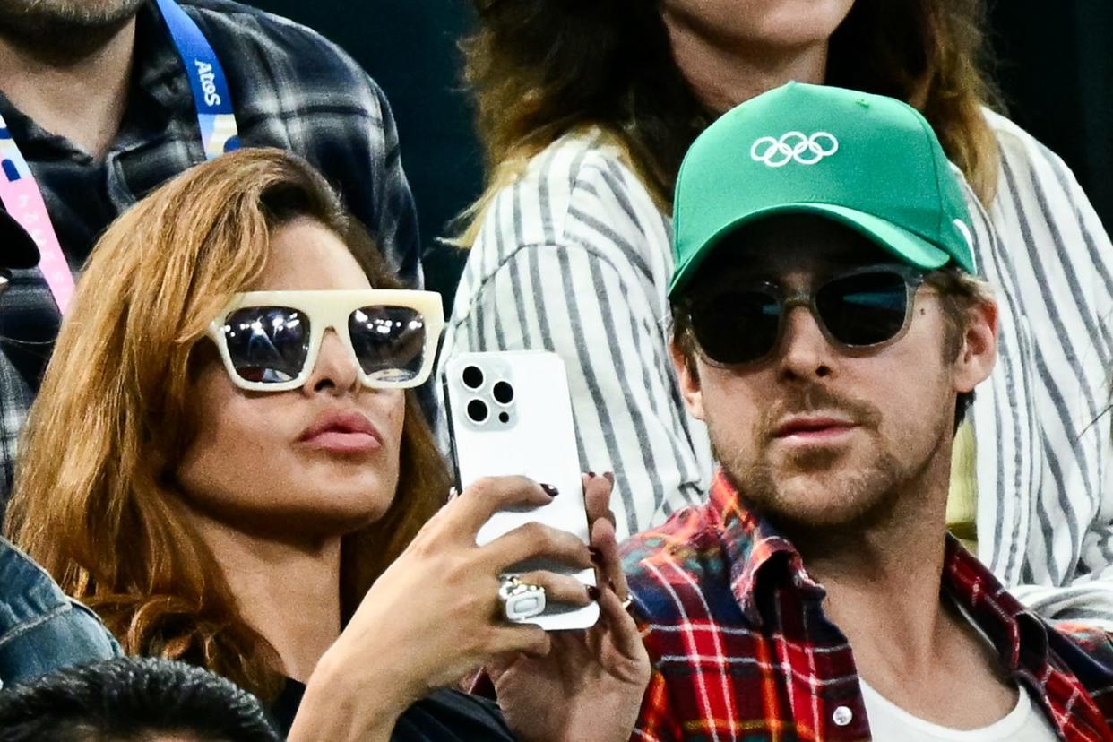 us actress eva mendes l and her partner canadian actor ryan gosling r attend the artistic gymnastics womens uneven bars final during the paris 2024 olympic games at the bercy arena in paris, on august 4, 2024 photo by loic venance afp photo by loic venanceafp via getty images