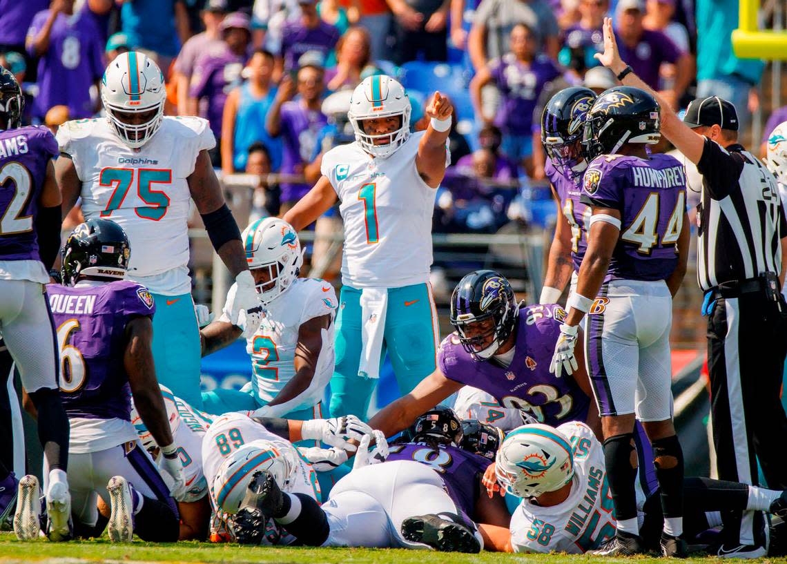 Miami Dolphins quarterback Tua Tagovailoa (1) reacts after a first down during second quarter of an NFL football game against the Baltimore Ravens at M&T Bank Stadium on Sunday, September 18, 2022 in Baltimore, MD.