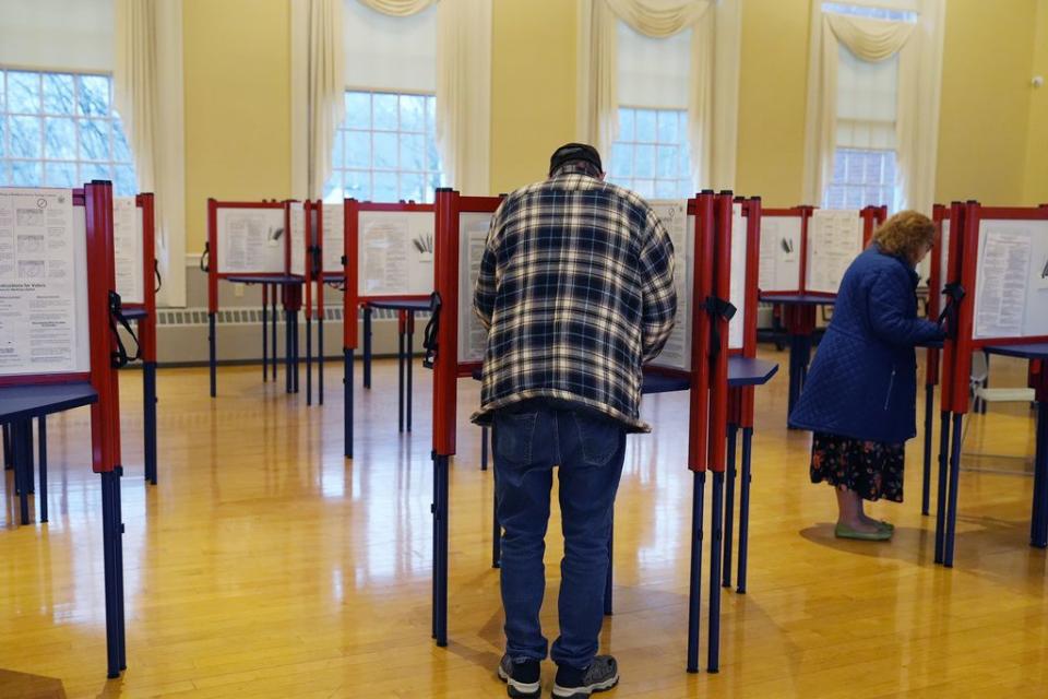 Voters mark ballots at the polling station in Kennebunk, Maine, Tuesday, March 5, 2024. Super Tuesday elections are being held in 16 states and one territory. Hundreds of delegates are at stake, the biggest haul for either party on a single day.   (AP Photo/Michael Dwyer)