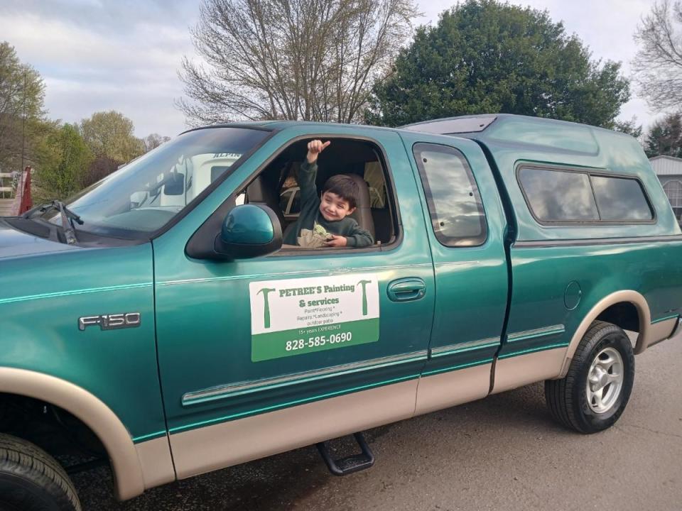 One of Joanna Bragg's sons in the truck she purchased through Working Wheels.