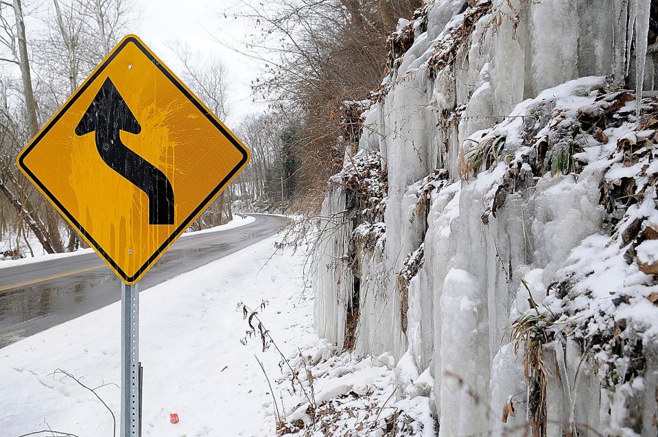 Ice forms on the rocks on the north side of Wally Road along the Mohican River on Monday, Feb. 15, 2021. TOM E. PUSKAR/TIMES-GAZETTE.COM