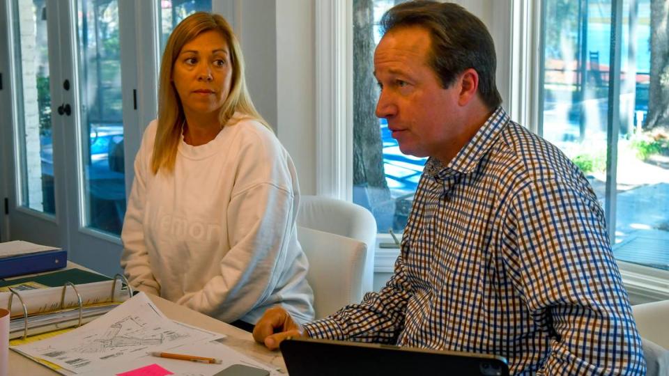 Christina and Benji Gecy go over documentation at their home on Thursday, October. 19, 2023 in the Belleview Bluff subdivision. The couple are concerned their property rights are being diminished as a developer builds 12, three-story buildings known as Integra Wharf at Battery Creek in front of their home and neighbors along Roberta Lane.