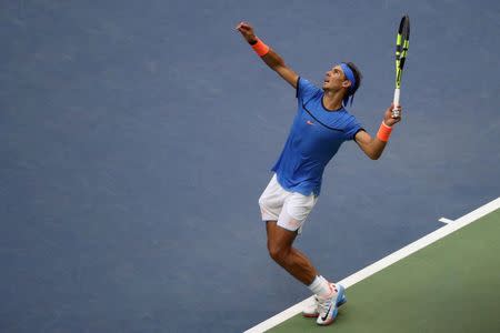 Sep 4, 2016; New York, NY, USA; Rafael Nadal of Spain serves against Lucas Pouille of France (not pictured) on day seven of the 2016 U.S. Open tennis tournament at USTA Billie Jean King National Tennis Center. Mandatory Credit: Geoff Burke-USA TODAY Sports