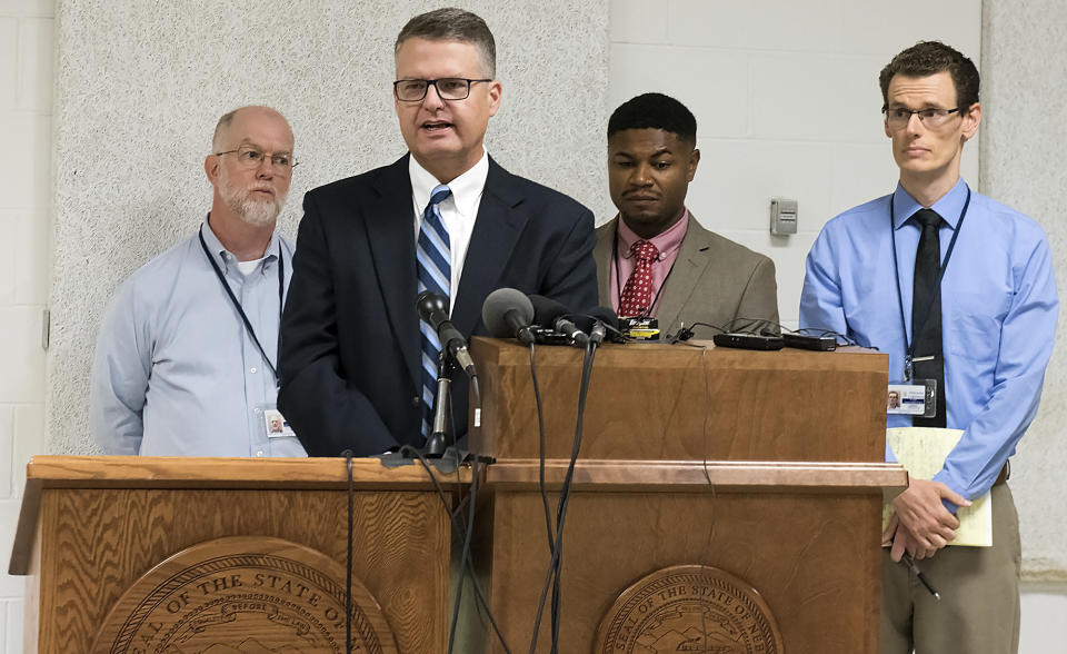 From left, media witnesses Brent Martin of Nebraska Radio Network, Joe Duggan of the Omaha World-Herald, Chip Matthews of News Channel Nebraska and Grant Schulte of The Associated Press answer questions after the execution of Carey Dean Moore on Tuesday, Aug. 14, 2018. at the Nebraska State Penitentiary. Nebraska carried out its first execution in more than two decades on Tuesday with a drug combination never tried before, including the first use of the powerful opioid fentanyl in a lethal injection. Moore had been sentenced to death for killing two cab drivers in Omaha in 1979. (Gwyneth Roberts /Lincoln Journal Star via AP)