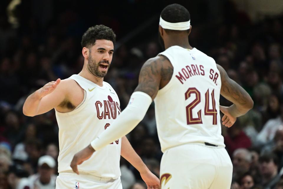 Mar 29, 2024; Cleveland, Ohio, USA; Cleveland Cavaliers forward Georges Niang (20) celebrates with forward Marcus Morris Sr. (24) during the first half against the Philadelphia 76ers at Rocket Mortgage FieldHouse. Mandatory Credit: Ken Blaze-USA TODAY Sports