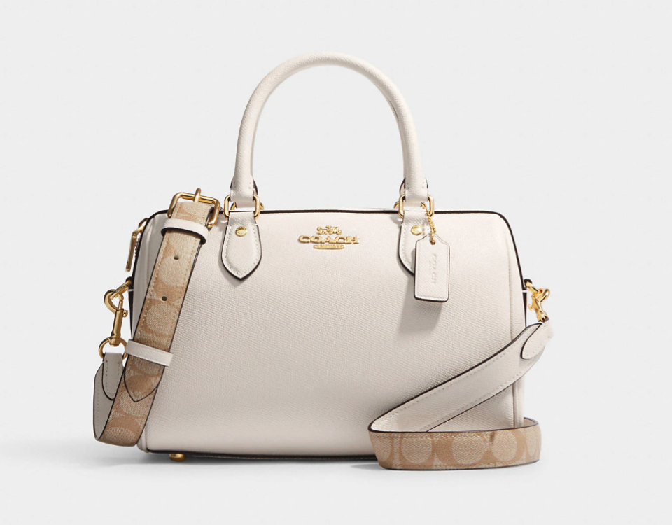 Rowan Satchel With Signature Canvas Detail. Image via Coach Outlet.