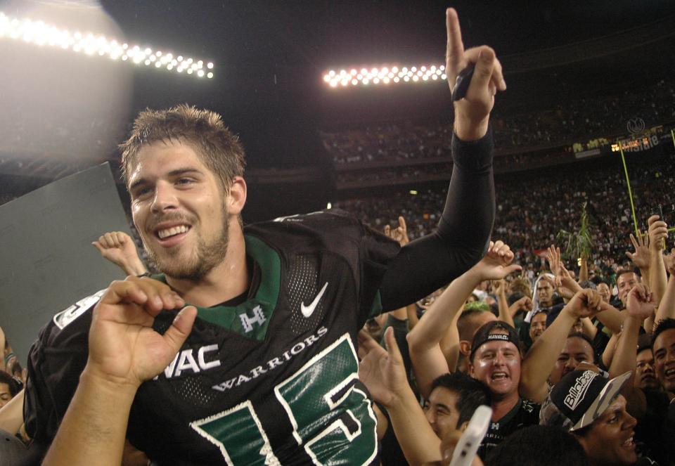 Colt Brennan (15) celebrates after defeating Boise State 39-27 in their college football game in Honolulu, in this Nov. 23, 2007 file photo.