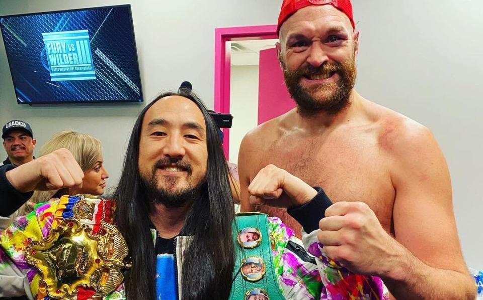 Tyson Fury was seen partying with his shirt off at a Las Vegas afterparty following his thrilling trilogy fight victory over Deontay Wilder on Saturday night - STEVEAOKI/TWITTER