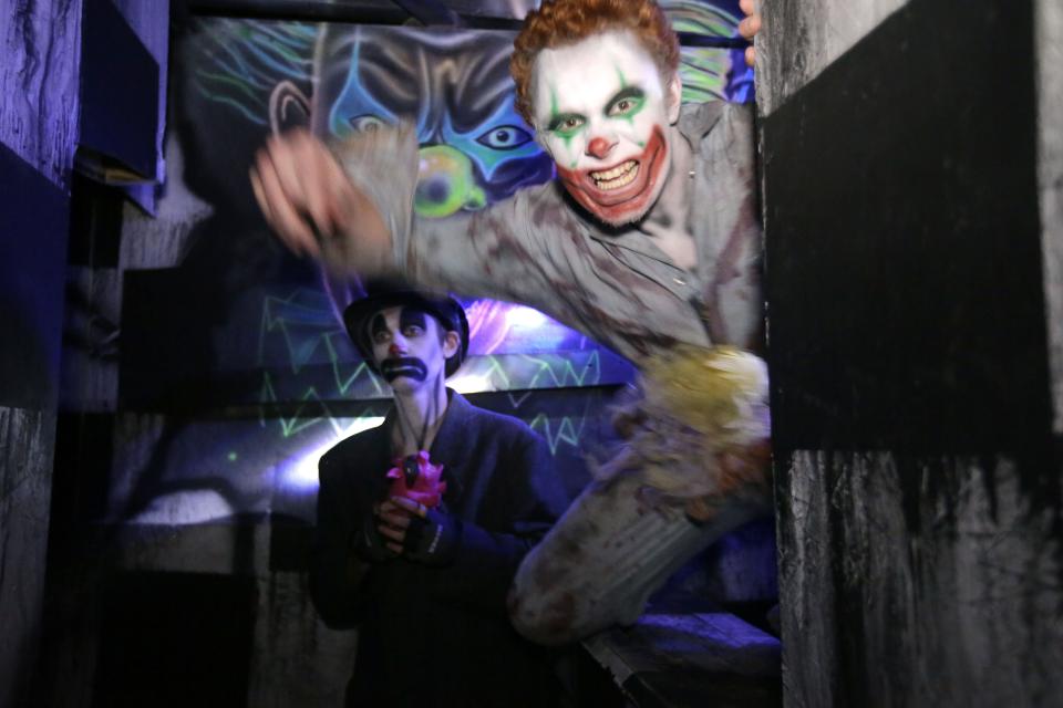 A pair of ghouls pop out to scare visitors at the Burial Chamber in Neenah in 2017.