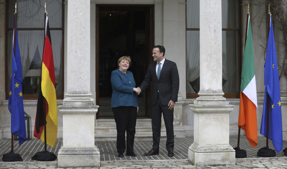 Irish Prime Minister Leo Varadkar greets German Chancellor Angela Merkel at Farmleigh House in Dublin, Ireland, Thursday, April 4, 2019. (AP Photo/Peter Morrison)