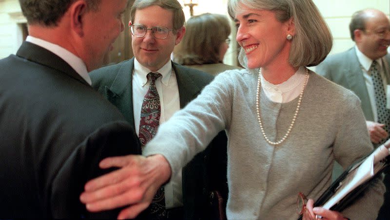 Then-Utah Attorney General Jan Graham gives then-Senate President Lane Beattie a friendly pat on the shoulder on Feb. 2, 1999, after the state Senate passed legislation. Graham, who served as Utah’s attorney general from 1993 to 2001, has died.