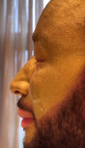 <p>Chrissy Teigen/Instagram</p> John Legend sheds golden tears in Instagram video.