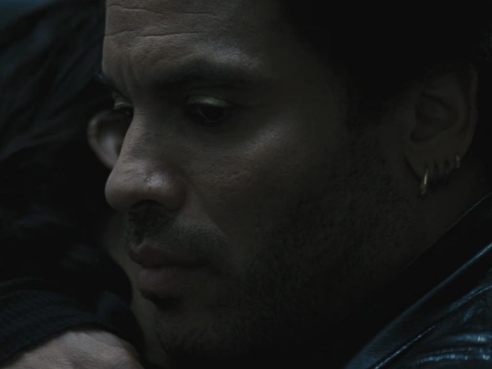 cinna hugging katniss in the hunger games catching fire