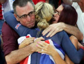 <p>Laura Trott of Britain celebrates with her family after winning the gold medal for the women’s omnium 25km points race at the Olympic Velodrome in Rio on August 16, 2016. (REUTERS/Eric Gaillard) </p>