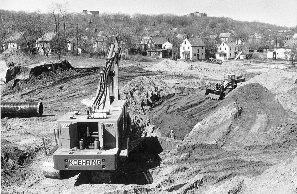 Crews work on a portion of what is now a 54-inch storm drain bed under the Akron Innerbelt. Bell Street used to run through the area.