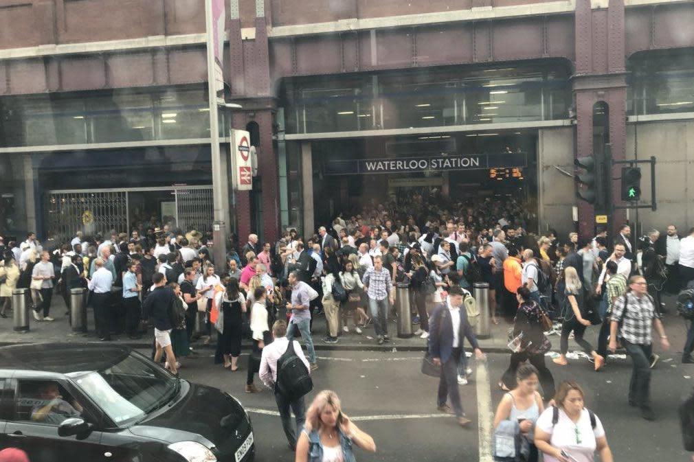 Commuters were queuing out of the entrance at Waterloo due to overcrowding: @SarahHyn