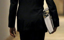 <p>President Barack Obama carries a binder containing material on potential Supreme Court nominees as he walks towards the residence of the White House in Washington February 19, 2016. This weekend, Obama is expected to review material his team has prepared for him on a replacement for late Justice Antonin Scalia. (Kevin Lamarque/Reuters) </p>