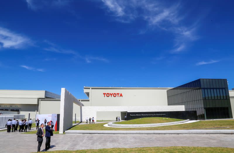 Employees walk at the Toyota Motor Corp new plant in Mexico's central state of Guanajuato