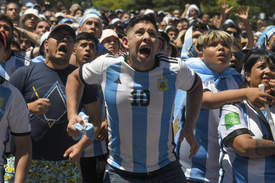 Argentine soccer fans celebrate their team's World Cup victory over France, in Buenos Aires, Argentina, Sunday, Dec. 18, 2022. (AP Photo/Gustavo Garello)