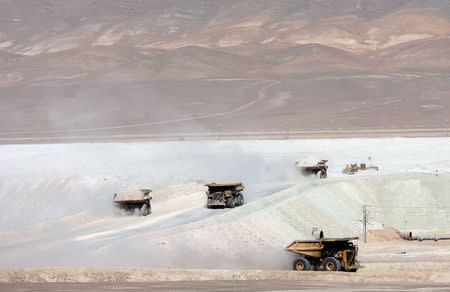 FILE PHOTO - Trucks travel along a road in the La Escondida copper mine near Antofagasta, about 1545 km (980 miles) north of Santiago city and 3100 meters (10,170 feet) above sea level in Chile on March 31, 2008. REUTERS/Ivan Alvarado/File Photo