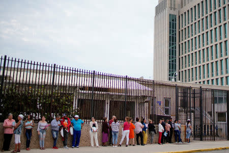 People wait in line to enter the U.S. embassy in Havana, Cuba, March 18, 2019. REUTERS/Alexandre Meneghini