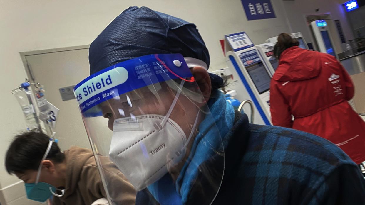  Somebody wearing a PPE mask in a Chinese hospital. 