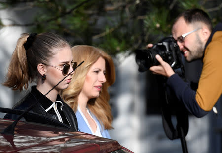 Slovakia's presidential candidate Zuzana Caputova walks next to her daughter as she attends the country's presidential election run-off at a polling station in Pezinok, Slovakia, March 30, 2019. REUTERS/Radovan Stoklasa