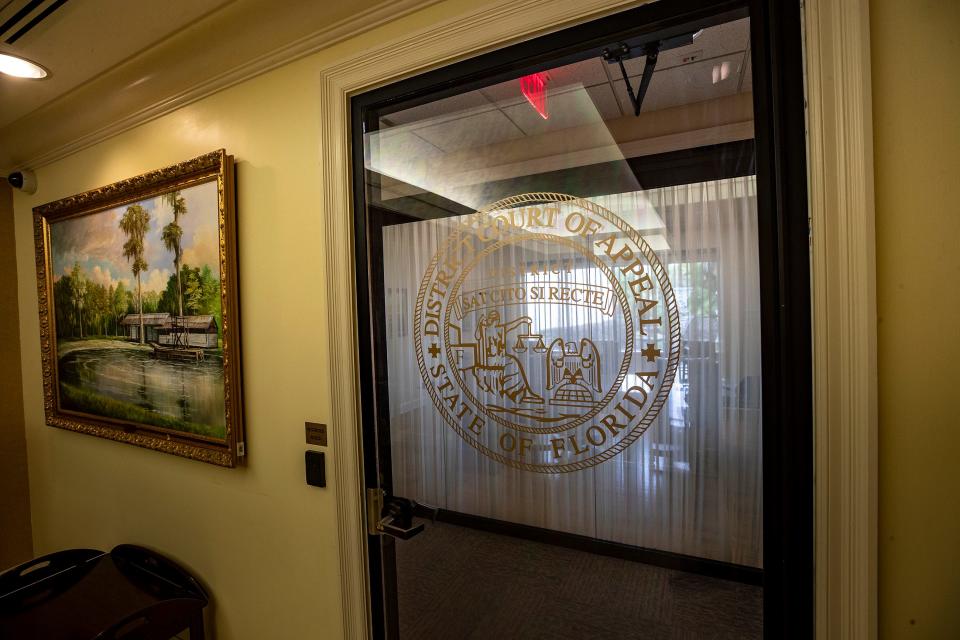 The logo of Florida's Sixth District Court of Appeal is seen on a door leading to a restricted area at the Lakeland facility. The Florida Legislature created the new court in last year's session and specified that it would retain the Robert Butler paintings at the office previously used by the Second District Court of Appeal.