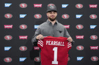 San Francisco 49ers first round draft pick Ricky Pearsall Jr. holds a jersey during an NFL football news conference, Friday, April 26, 2024, at the team's facility in Santa Clara, Calif. (AP Photo/Godofredo A. Vásquez)