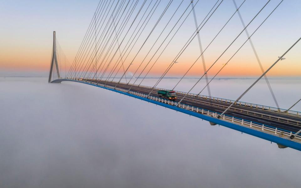 The Pont de Normandie (Normandy Bridge) emerges from the morning mist